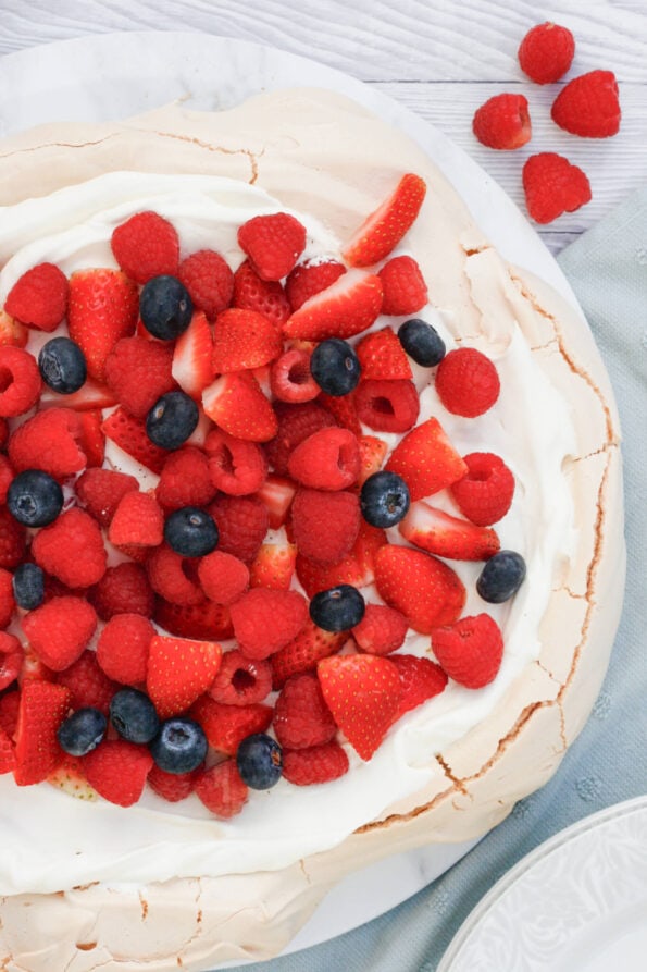 Pavlova on a serving plate. 