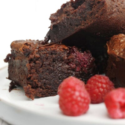 raspberry brownies on a serving plate