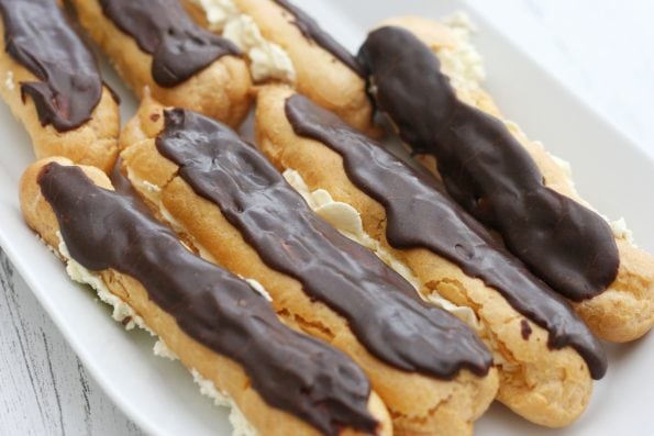 chocolate eclairs on a plate