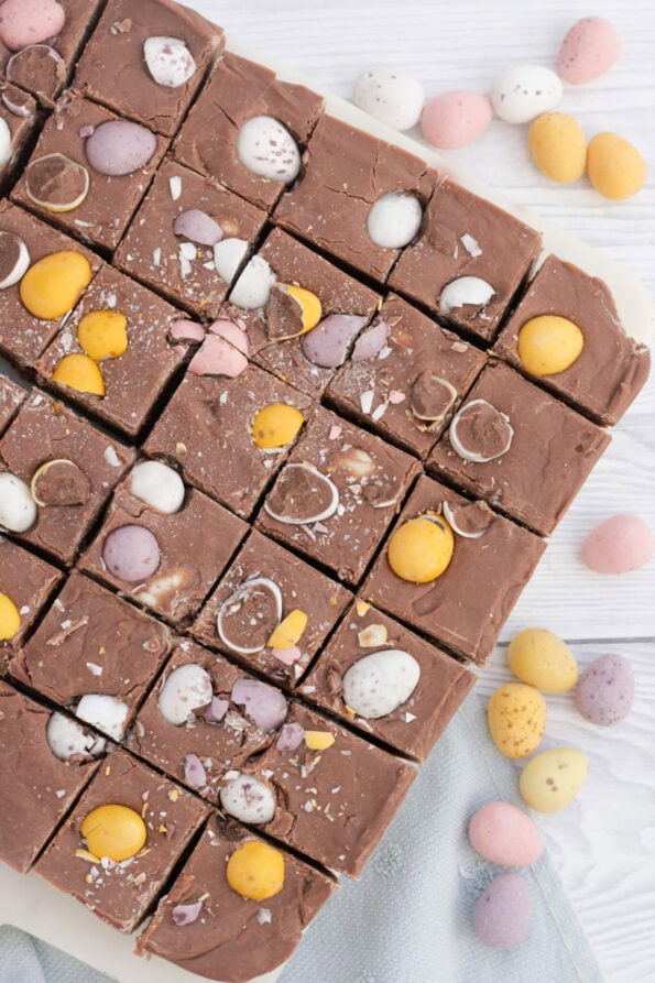 Easter fudge cut into pieces on a serving plate.