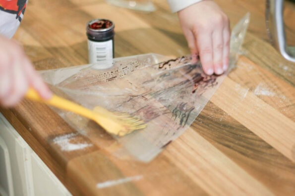 spreading food colouring into a piping bag.