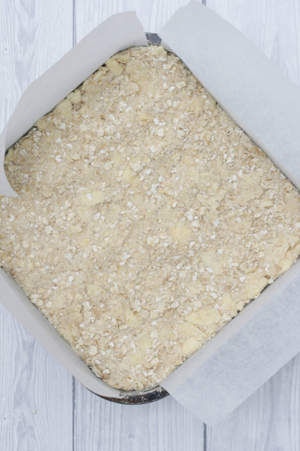 banana oatmeal bars unbaked in a baking tin.