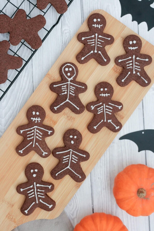 skeleton biscuits on a wooden board.