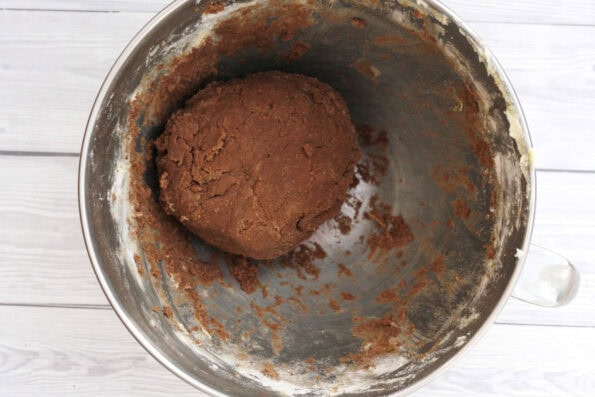 a ball of chocolate biscuit dough in a bowl.