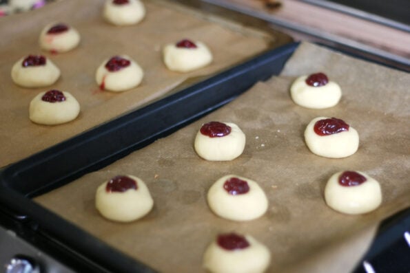 jam thumbprint cookies before they go in the oven