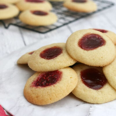 jam thumbprint cookies on a serving plate