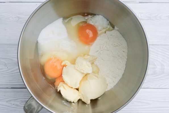 eggs, butter, flour and sugar in a mixing bowl.
