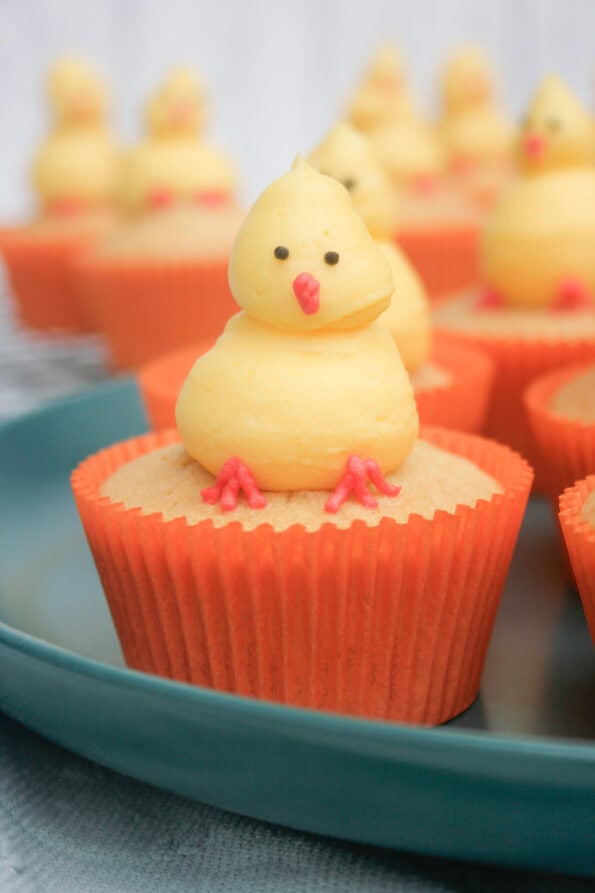 Easter chick cupcake on a green plate.