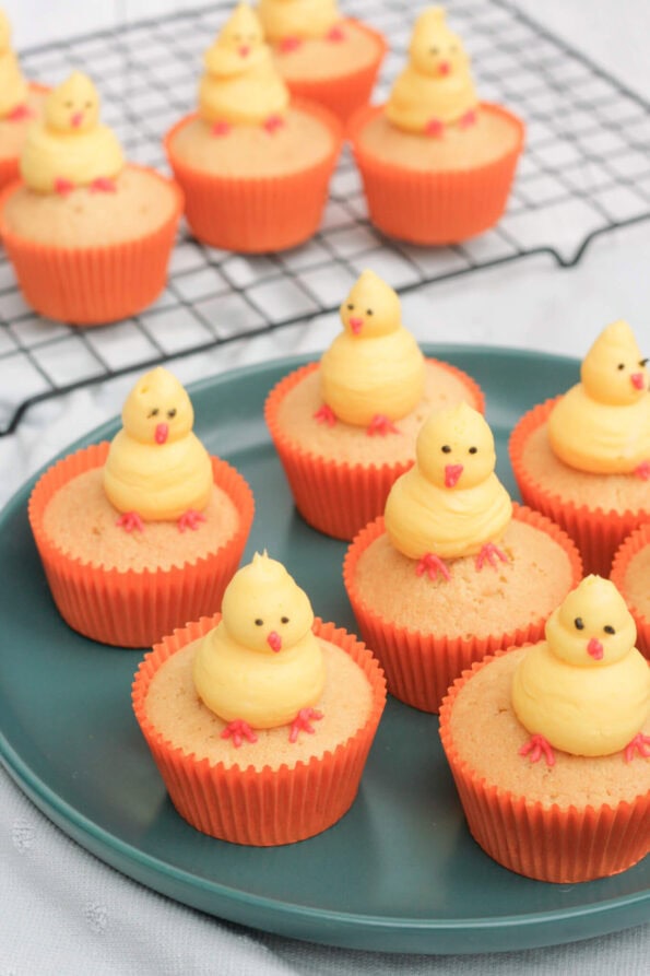 Easter chick cupcakes on a green plate.