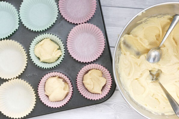 filling cupcake cases with cupcake batter