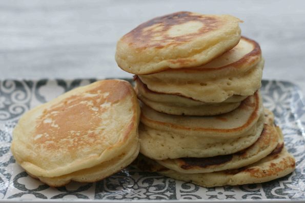 fluffy pancakes on a patterned dish