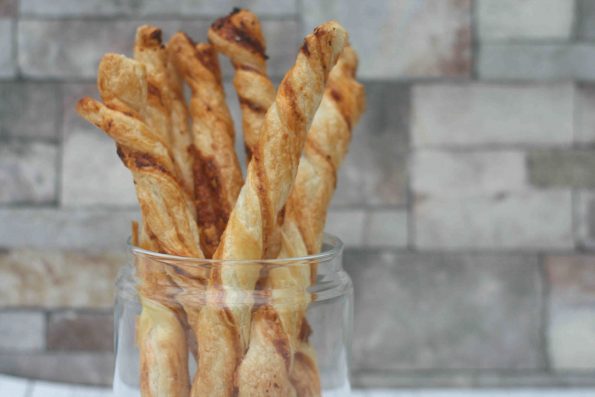 Cheese twists upright in a jar