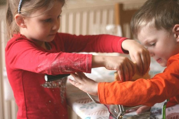 Kids using a pasta machine