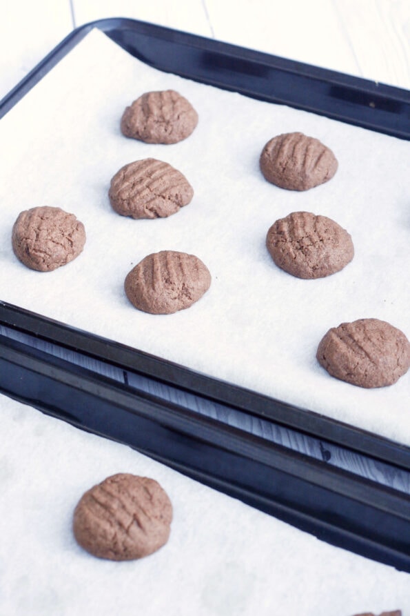 chocolate biscuits on a baking tray.