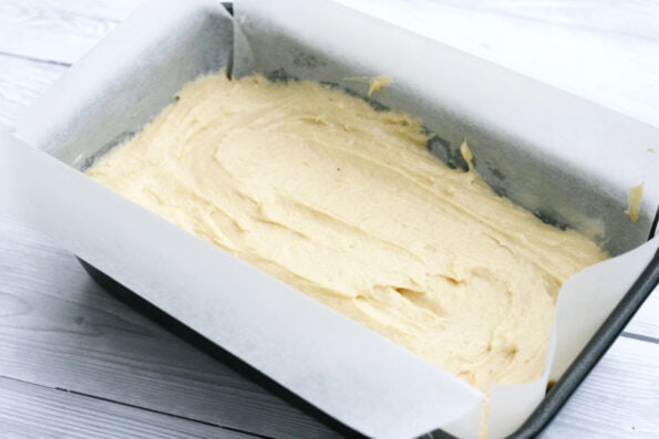 lemon drizzle cake batter in a baking tin