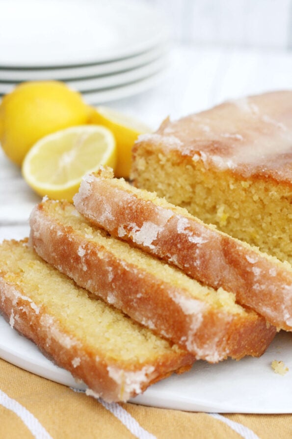 lemon drizzle loaf sliced on a serving plate