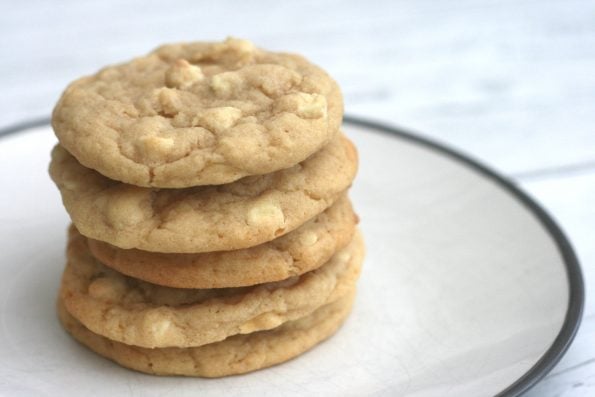 white chocolate chip cookies in a pile on a plate