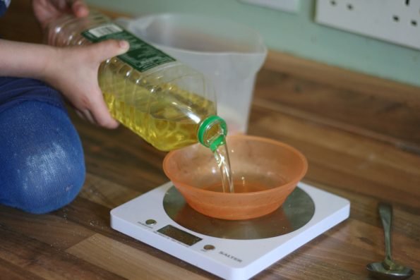 pouring oil into a bowl