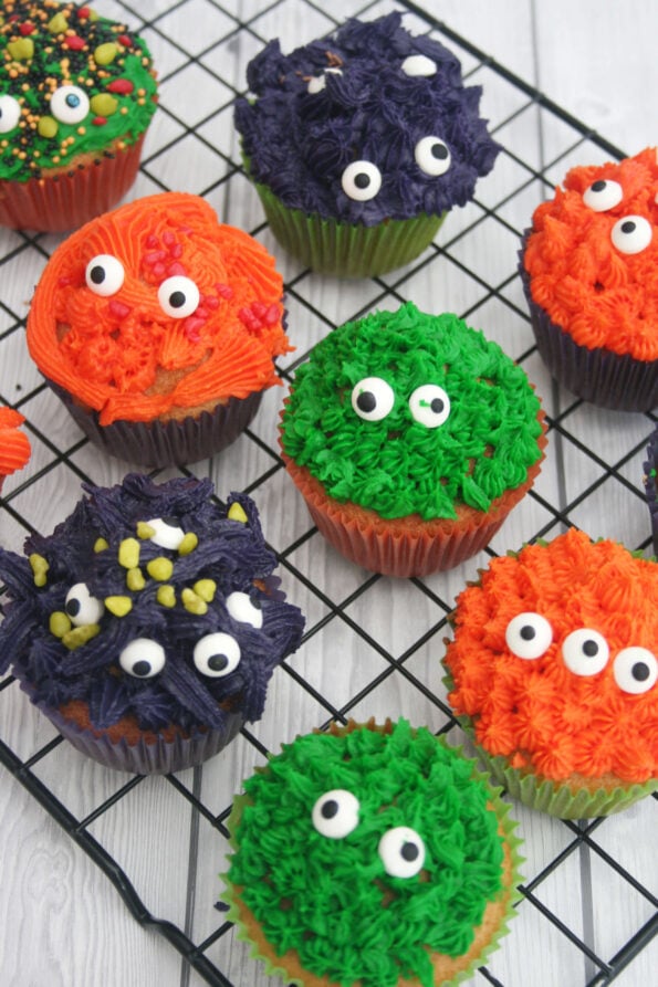 Halloween monster cupcakes on a wire rack