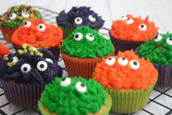 Halloween monster cupcakes on a wire rack