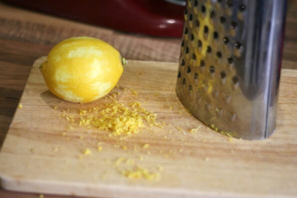 zested lemon on a chopping board