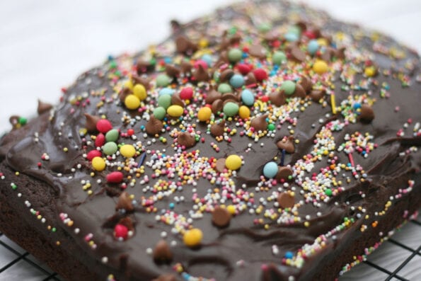 chocolate traybake decorated with colourful sprinkles