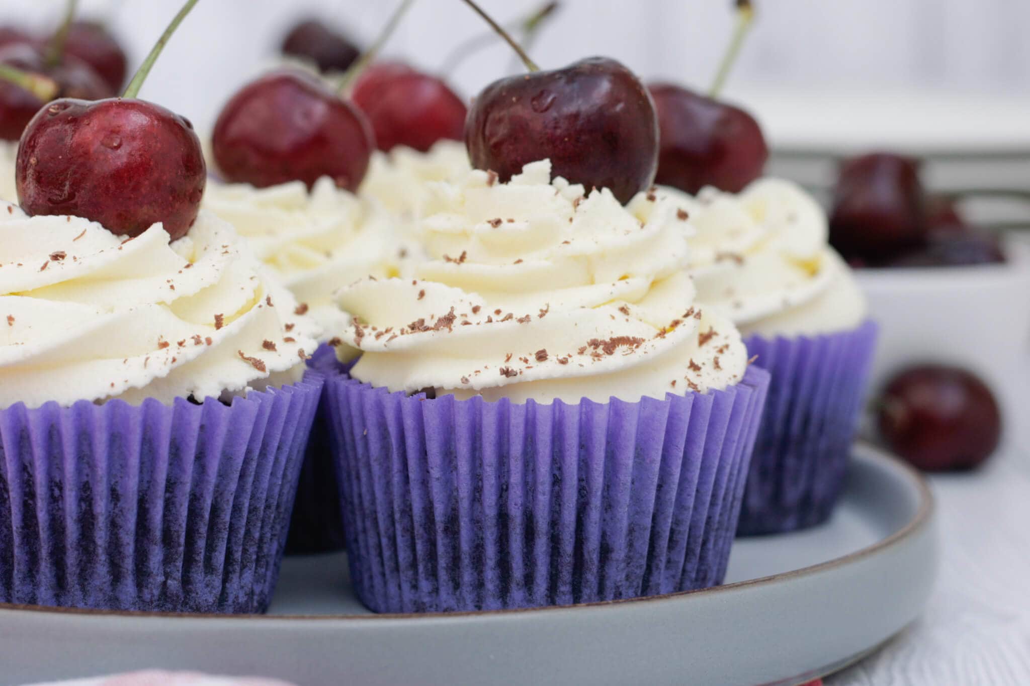 black forest cupcakes on a serving plate.
