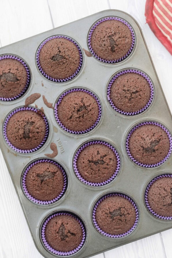 chocolate cupcakes in a muffin tin.