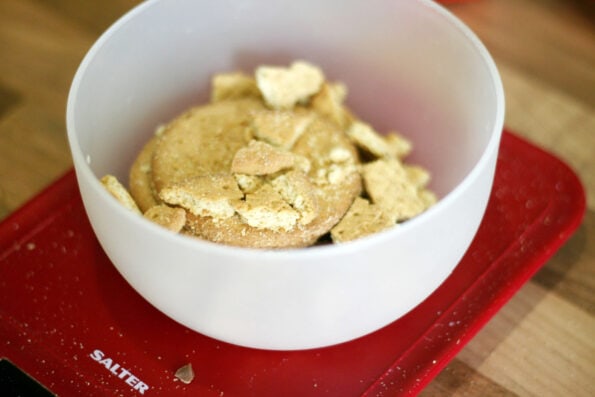 biscuits being broken up in a bowl