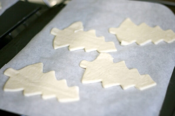 christmas tree pizzas bases on a baking tray