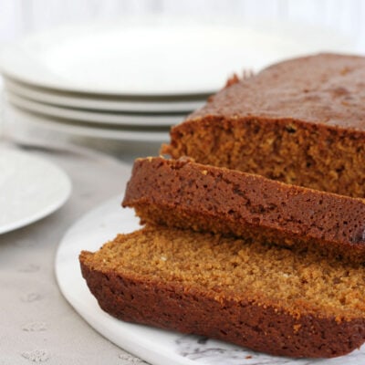 ginger loaf cake sliced on a serving plate