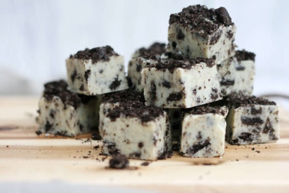 Oreo fudge pieces on a wooden board