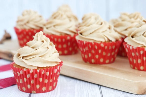 Biscoff cupcakes on a wooden board