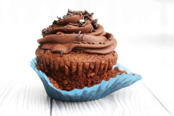 chocolate fudge cupcake in a blue cupcake case