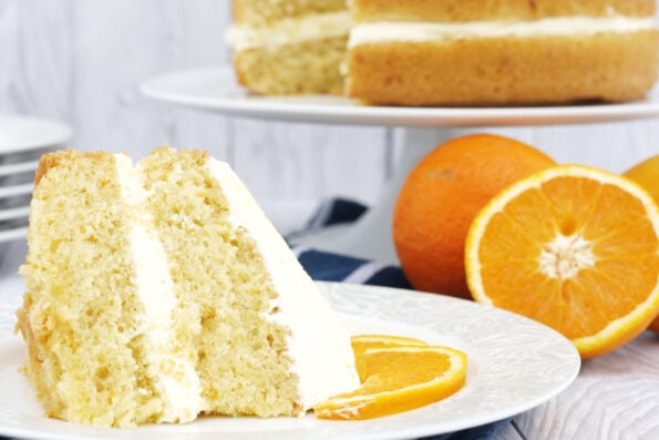 a slice or orange sponge cake on a plate