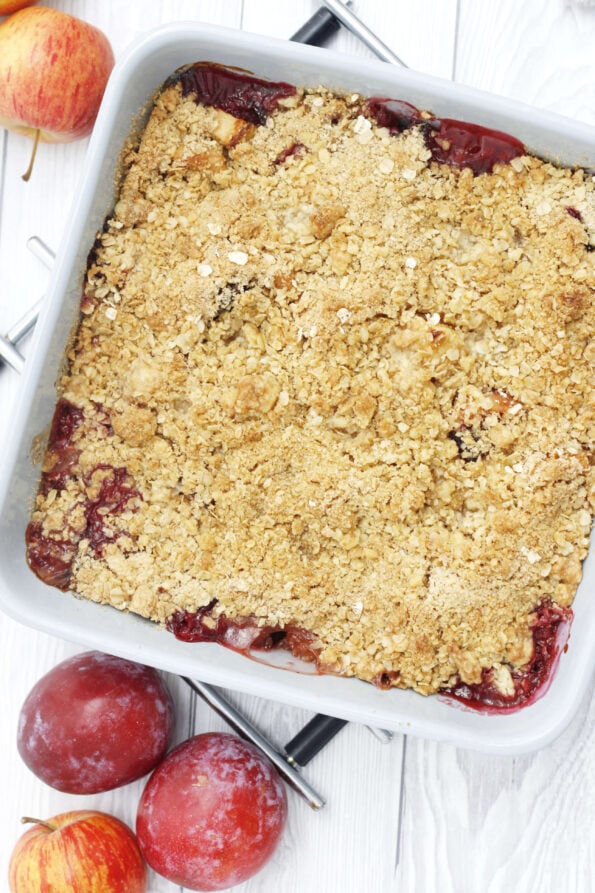 plum and apple crumble in a baking dish
