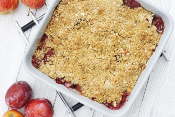 plum and apple crumble in a baking dish