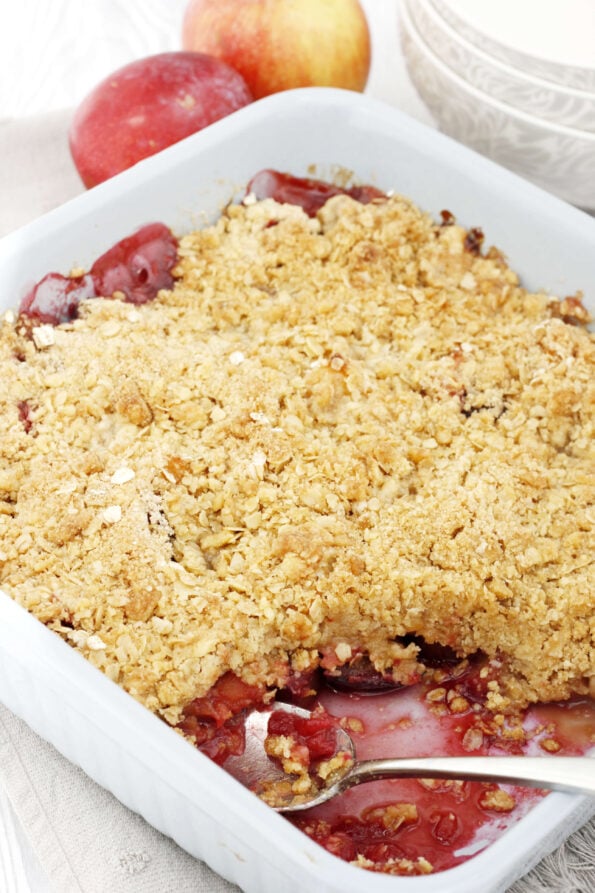 plum and apple crumble in a baking dish