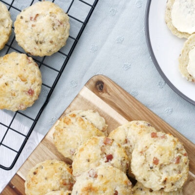 savoury scones on a wooden board and wire rack.