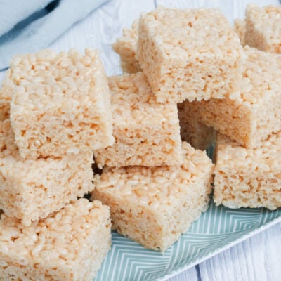 Rice Krispie treats on a serving plate.
