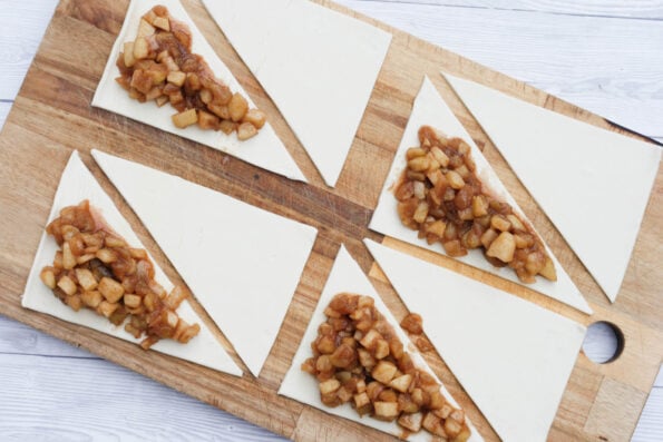 apple filling on puff pastry triangles.
