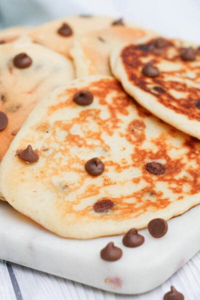 chocolate chip pancakes on a serving plate.