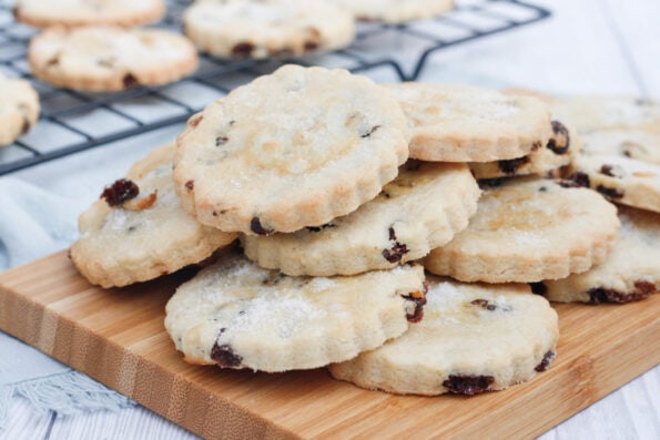 raisin biscuits on a wooden serving board.