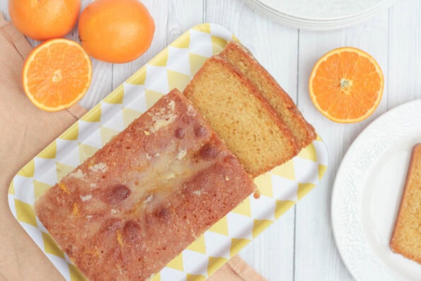 orange drizzle cake on a serving plate,