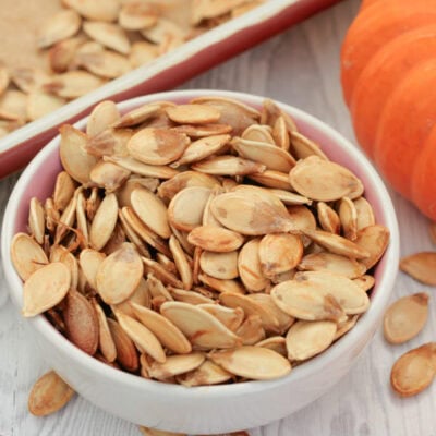 Roasted pumpkin seeds in a bowl.