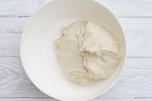 dough in a white bowl.