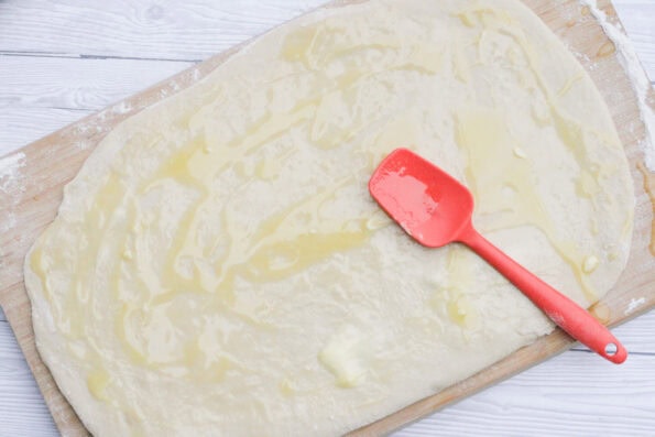 melted butter spread onto rolled out dough.