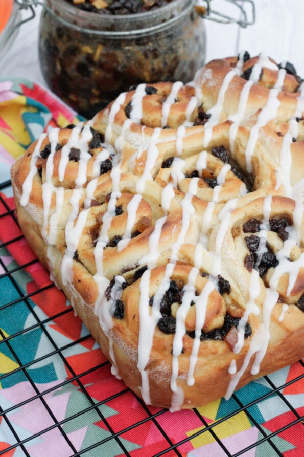 mincemeat cinnamon rolls on a wire rack.