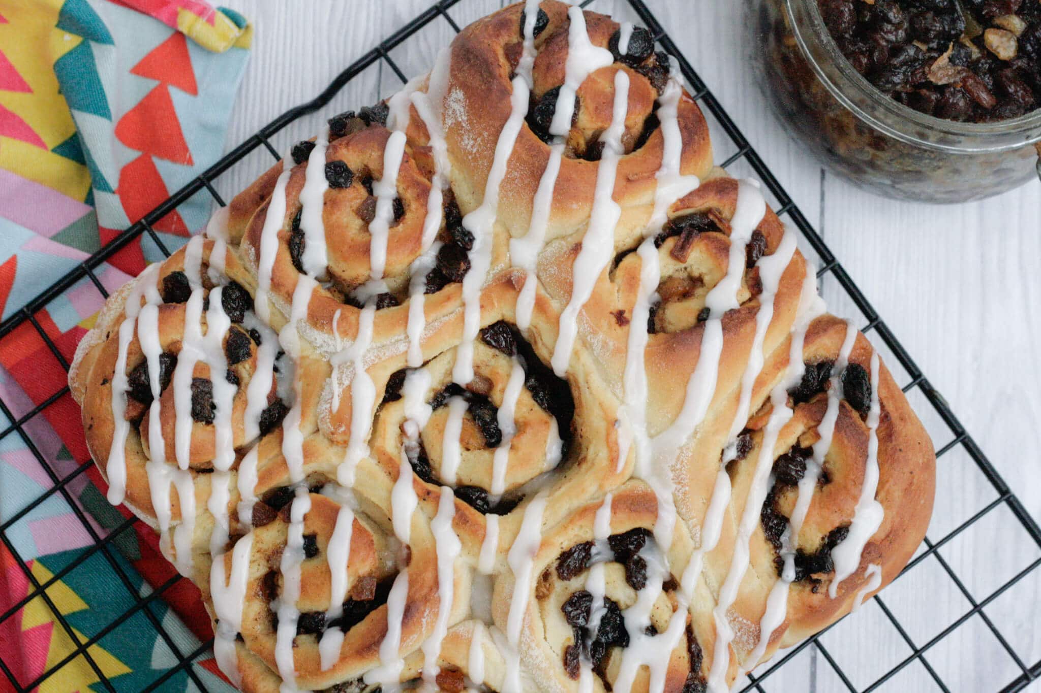 mincemeat cinnamon rolls on a wire rack.