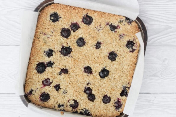 blueberry flapjacks baked in a baking tin.